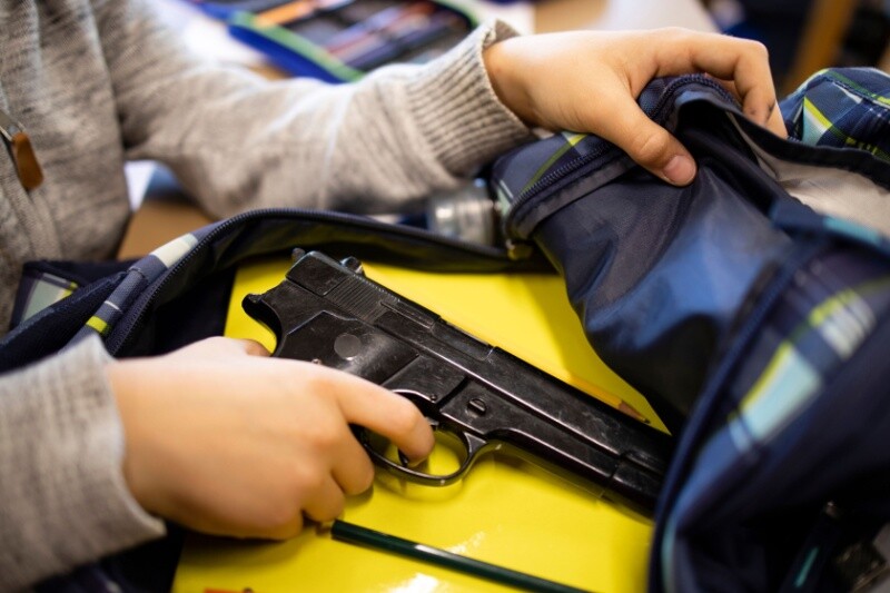 Gun in a kids backpack.